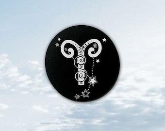May include: A black circle with a white stylized illustration of the astrological sign Aries, with a constellation of stars around it.
