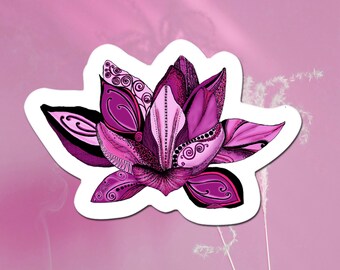 May include: A pink and purple flower sticker with intricate details. The flower has a stylized design with swirls and dots.