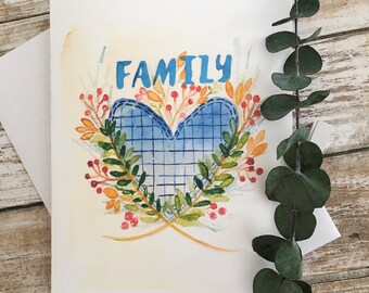 Carte de voeux à l'aquarelle de fleurs et couronne de coeur bleu texte "Famille"