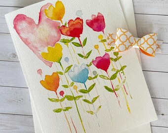 Carte de voeux de fleurs en forme de coeur