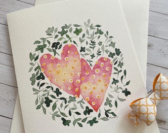 Illustration de carte de voeux de 2 coeurs d'amour et de feuillage vert