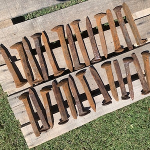Vintage genuine rustic iron railroad spikes.  For crafts and projects.