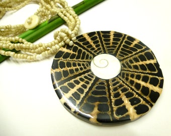 Shell necklace with snail parts and Shivaeye, handmade Bali