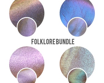 May include: Four round eyeshadow samples in a folklore bundle. The colors are a shimmery purple, a shimmery green, a shimmery blue, and a shimmery gold.