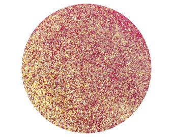 May include: A close-up of a red and gold glitter circle.