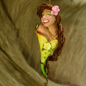 Calla Lilly lady with pink and yellow tea roses, butterflies, brown hair and freckles. Adorned with swarovski crystals and gold chains