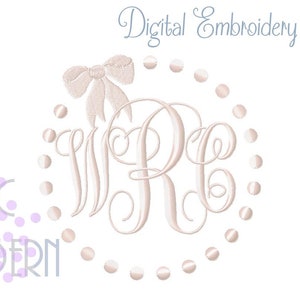 May include: A white embroidery design of a monogram with the letters "WR" in a circle with a bow at the top. The circle is surrounded by a row of small dots.