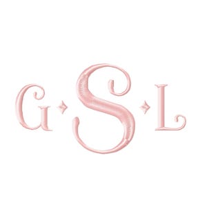 May include: A light pink embroidered monogram featuring the letters G, S, and L in a decorative serif font. The letters are separated by small four-pointed star icons. The stitching has a textured, satin-like appearance with a subtle sheen.