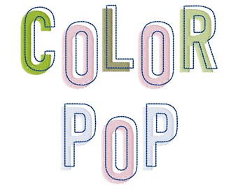 May include: An embroidery design featuring the words COLOR POP in a sans-serif font. The letters are stitched in various pastel colors including lime green, light pink, olive green, and light blue, each outlined with a dark navy blue thread.