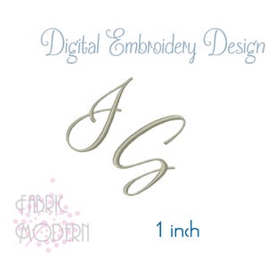 May include: A digital embroidery design featuring the letters J and G in a light olive green cursive script. The text Digital Embroidery Design appears at the top, and the text 1 inch is visible at the bottom right, indicating the size.