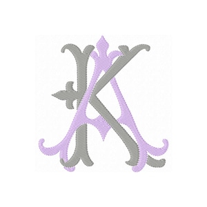 May include: An embroidered monogram featuring the letters A and K intertwined. The letter A is rendered in a light lavender thread with decorative flourishes, while the letter K is stitched in a contrasting grey thread over the top.