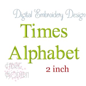 May include: A digital embroidery design featuring the text Digital Embroidery Design in light blue, Times Alphabet in lime green, and 2 inch in red. The logo FABRIC MODERN with pink dots is visible in the bottom left corner of the image.