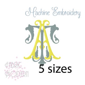 May include: A machine embroidery design featuring a stylized monogram of the letters T and A in yellow and grey thread. The text Machine Embroidery appears at the top, and the text 5 sizes appears at the bottom right. The logo FABRIC MODERN is visible.