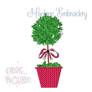 May include: Machine embroidery design of a green topiary tree with a red and white ribbon tied around the trunk. The tree is in a pink pot with a chevron pattern.