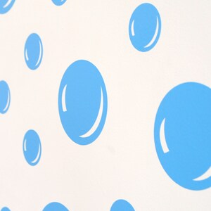 May include: A white background featuring a pattern of light blue, oval-shaped designs. Each oval has a white, curved highlight, creating a bubble-like appearance. The design is repeated across the surface.