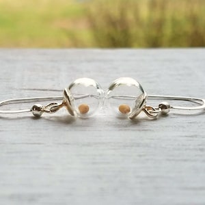 Mustard seed earrings in sterling silver. Tiny mustard seeds dangle from lovely hand-made sterling silver hooks.