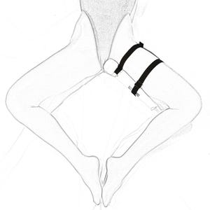 May include: A black strap with two adjustable buckles is attached to a white object. The strap is worn around the thigh.