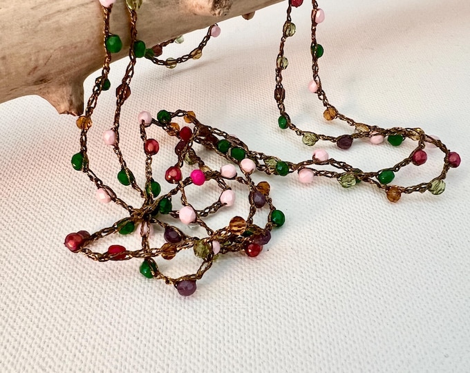 Long crochet necklace with golden thread and crystals, Textile jewel by Piera Romeo