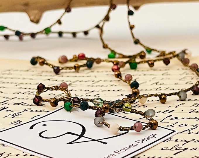 Long crochet necklace with golden bronze thread and crystals, Textile jewel by Piera Romeo