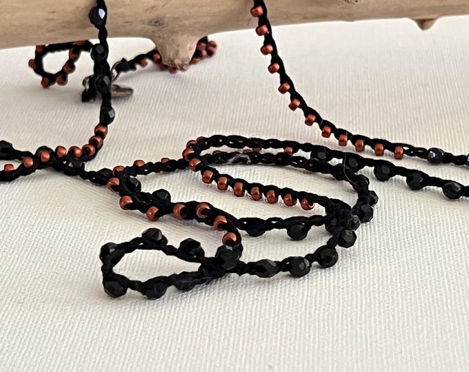 Long crochet necklace with black thread and crystals, Textile jewel by Piera Romeo