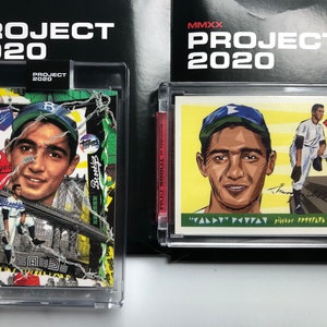 May include: Two baseball cards featuring a baseball player in a blue and white uniform. The card on the left has a colorful, abstract design with the words "Dodger" and "Brooklyn" visible. The card on the right has a yellow background with a red diamond and the text "MMXX PROJECT 2020".