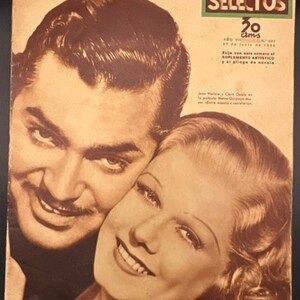 May include: Vintage magazine cover featuring a sepia-toned image of two smiling people. The man has dark hair and a mustache, while the woman has blonde hair. The magazine title "FILMS SELECTOS" is visible.