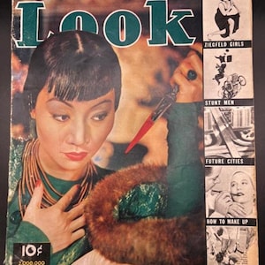 May include: Vintage "Look" magazine cover featuring a woman with dark hair and red lipstick, holding a knife. The cover includes text: "CRIMINALS ARE RATS," and "World's Most Beautiful Chinese Girl." Additional text includes "ZIEGFELD GIRLS" and "STUNT MEN."