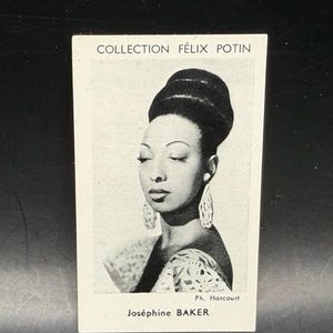 May include: A black and white rectangular trading card featuring a portrait of Josephine Baker with a high bun hairstyle and large earrings. The text reads COLLECTION FÉLIX POTIN at the top, Ph. Harcourt in the corner, and Joséphine BAKER at the bottom.