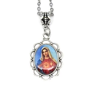 May include: Silver chain necklace with a silver oval pendant featuring a colorful image of the Virgin Mary with a red heart.