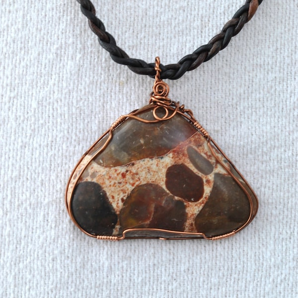 Puddingstone pendant; handmade necklace; braided leather necklace; earth tone pendant; conglomerate rock pendant; triangle pendant