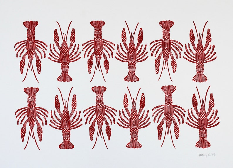 This is an original hand carved block print of a red crawfish or lobster pattern in two rows on fine art paper.