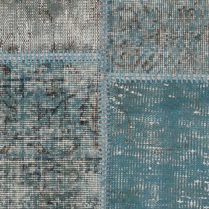 Faded Blue and Grey Patchwork Rug. Soft Pastel coloured patches of overdyed rugs stitched together to make a contemporary rug