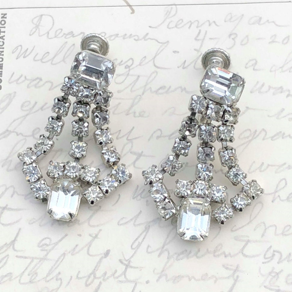 Silvertone Alpha Female Oval Black Crystal Clip on Earrings Silvertone Alpha Female Oval Black Crystal Clip on Earrings