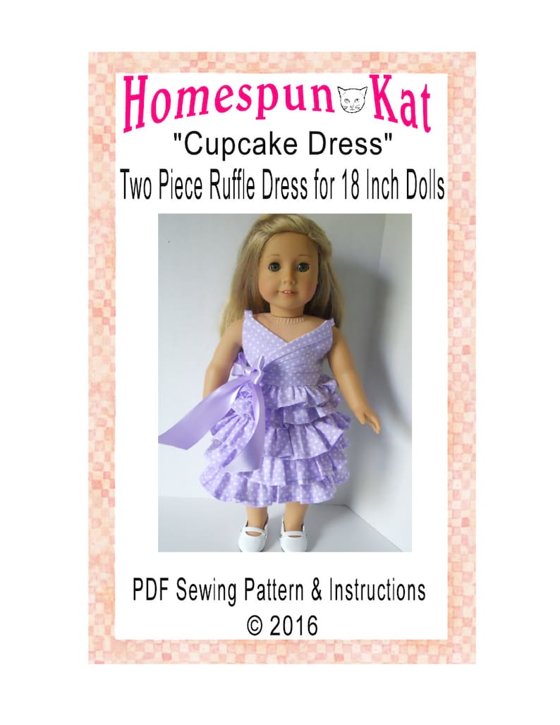 May include: A PDF sewing pattern for a two-piece ruffle dress for 18-inch dolls. The dress is lavender with white polka dots and a matching lavender ribbon. The pattern is called "Cupcake Dress" and is by Homespun Kat. &copy; 2016.