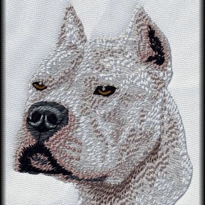 May include: Embroidered image of a white American Pit Bull Terrier dog's head with brown markings. The dog has a serious expression and its ears are cropped.