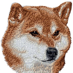 May include: Embroidered patch of a Shiba Inu dog's head. The patch depicts the dog's features, including pointed ears, dark eyes, and a black nose. The dog's fur is rendered in shades of brown, white, and tan.