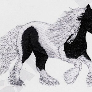May include: Black and white horse with a long flowing mane and tail. The horse is running with its legs extended.