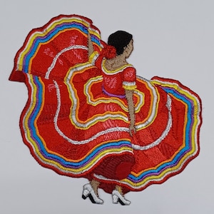 May include: Embroidered patch of a woman in a red, white, and blue dress with a colorful skirt. The woman is dancing and her skirt is flowing.