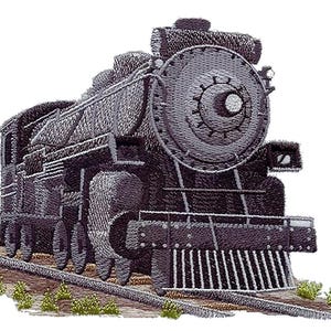 May include: A black and grey vintage steam locomotive train engine with a large wheel at the front. The train is on a track with green grass and dirt at the sides.