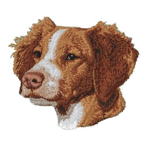 May include: Embroidered image of a brown and white Brittany dog with floppy ears. The dog is looking to the left.