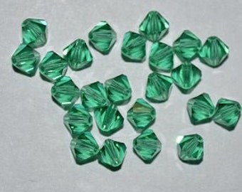24 - LT. EMERALD  4mm Genuine Swarovski Crystal Bicone Beads -Lt. Emerald H11-1-02