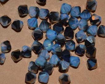 24 - 4mm Genuine Swarovski Crystal Bicone Beads - White Opal Sky Blue (H3-7-06)