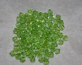 20 - 6mm Genuine Swarovski Crystal Bicone Beads - Peridot (H11*1-6-06)