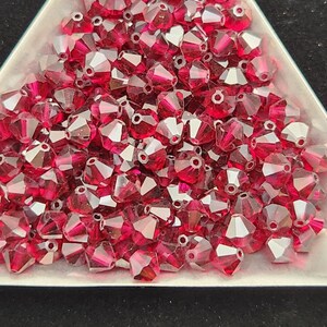 50 - 5mm Genuine Swarovski Crystal Bicone Beads - Rub y Satin H11-7-04