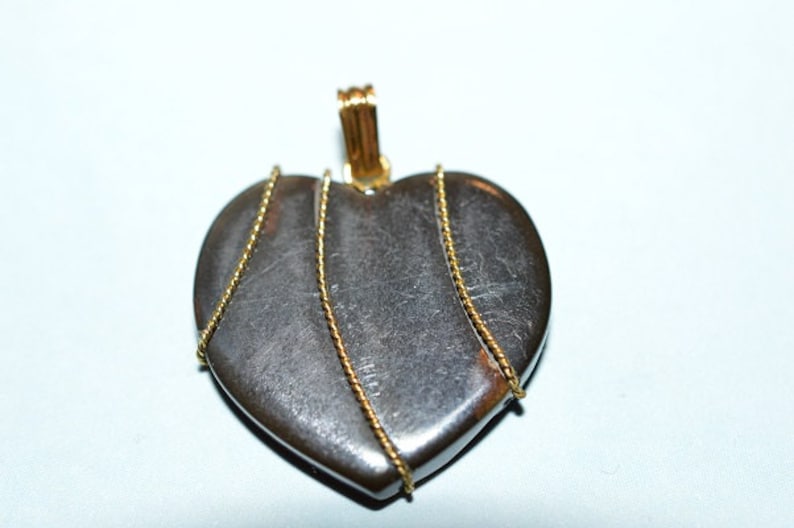 23mm Blackstone Heart pendant with Gold twisted wire wrapped 1060047