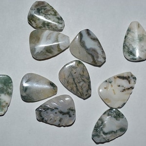 May include: A collection of polished moss agate stones. The stones are teardrop-shaped, with a mix of white, gray, and green patterns. The natural patterns vary across each stone, creating a unique look.