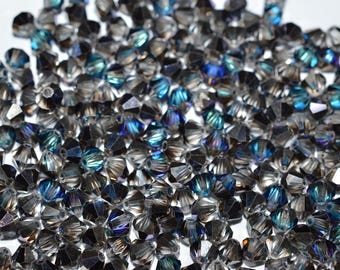 24 - 4mm Genuine Swarovski Crystal Bicone Beads - Bermuda Blue H1-1-05