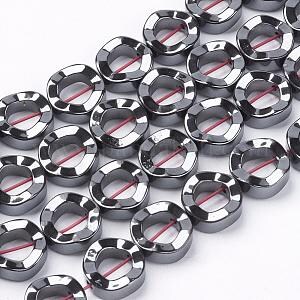 May include: A strand of black hematite beads with a faceted, oval shape and a hole in the center. The beads are approximately 10mm in diameter.