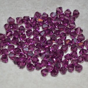 24 - AMETHYST 4mm Bicone Beads - Article  5301 H1-1-01