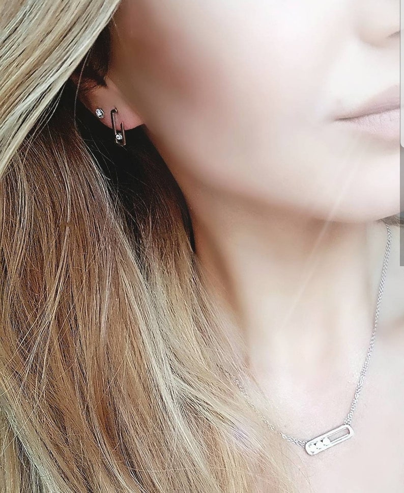 The Gigi Crystal Drop Earrings plain surround